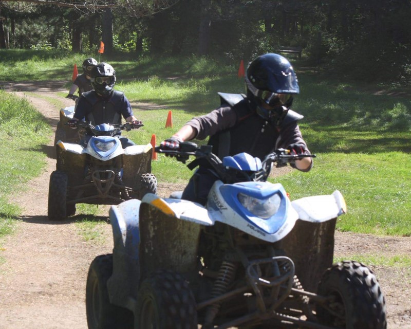 Scouts riding ATVs at Tomahawk Scout Camp