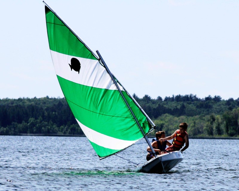 Two Scouts sailing at Scouts BSA Summer Camp